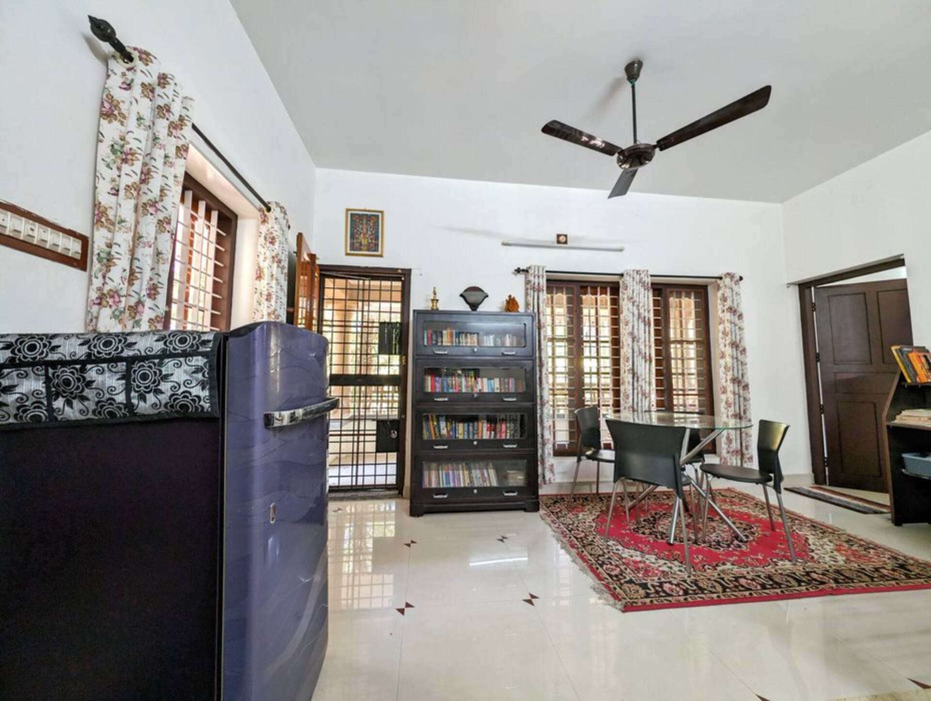 The library and reading room, shelves of books and a quiet chair.